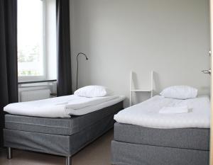 Postel nebo postele na pokoji v ubytování Sidsjö Hotell & Konferens