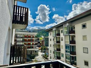 a view from a balcony of a city with buildings at D'Hérens apartment in Breuil-Cervinia
