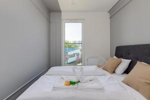 Posteľ alebo postele v izbe v ubytovaní Green Square Apartments Świnoujście by Noclegi Renters