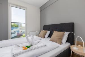 Posteľ alebo postele v izbe v ubytovaní Green Square Apartments Świnoujście by Noclegi Renters
