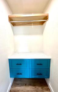 a blue cabinet in the corner of a closet at AZUL on Avenida Del Mar (1/2 Mile to the PIER!) in San Clemente