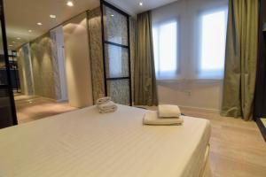Posteľ alebo postele v izbe v ubytovaní Letmalaga Granada Premium