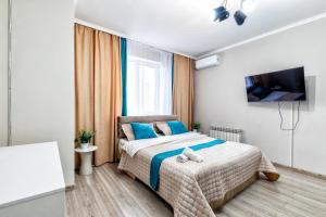 Postel nebo postele na pokoji v ubytování ЖК Арман Кала + 3 fotografie