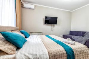 Postel nebo postele na pokoji v ubytování ЖК Арман Кала