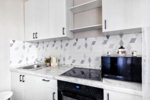 Kuchyň nebo kuchyňský kout v ubytování ЖК Арман Кала