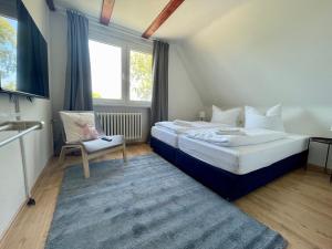 Postel nebo postele na pokoji v ubytování Hostel DünenMeer