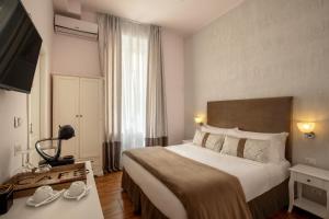 En eller flere senge i et værelse på Juno Pantheon