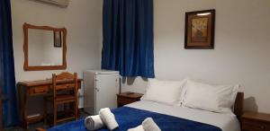 A bed or beds in a room at San Georgio Hotel