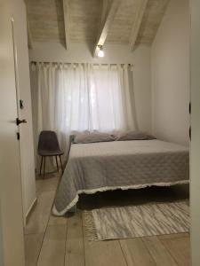 a bedroom with a bed and a window at Romantic apartments in Šibenik
