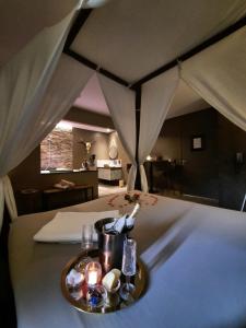 a plate of food on a bed in a tent at Nuits Blanches in Liège