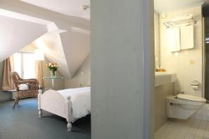 Ванна кімната в Hotel Hirschen am See
