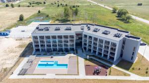 an overhead view of a building with a pool at Aqua Apartment Šventovė, By Cohost in Palanga