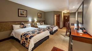 African Sky Hotels - Pine Lake Inn客房内的一张或多张床位