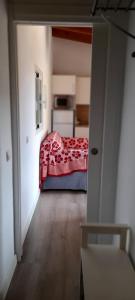 a bedroom with a bed with a red blanket at Paradise, Porto Saler ET7104 in La Savina