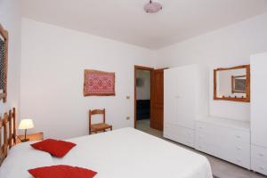 Letto o letti in una camera di Trilo Mare