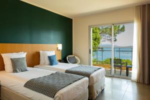 Postel nebo postele na pokoji v ubytování Hotel Costa Salina