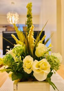 a bouquet of white flowers in a wooden box at * * * J Travellers' Choice 2023 in Iloilo City +12 photos
