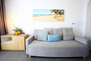 a living room with a couch and a table at Labranda Alyssa Suite Hotel in Playa Blanca