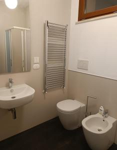 a bathroom with a toilet and a sink at La Terrazza Di CavaLegni in Porto Santo Stefano