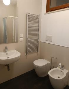 a bathroom with a toilet and a sink at La Terrazza Di CavaLegni in Porto Santo Stefano +27 photos