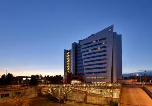 a tall building with a lot of windows at UNAHOTELS Malpensa in Cerro Maggiore