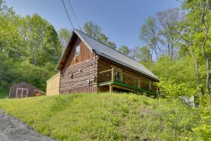 a wooden cabin on top of a hill at Private Cabin Rental in the Catskill Mountains! in Hamden