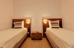 En eller flere senge i et værelse på Domaine Pozzo di Mastri