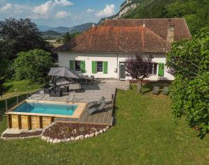 an aerial view of a house with a swimming pool at Le gîte de la cascade in Champagneux