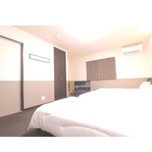 מיטה או מיטות בחדר ב-Kyo Fushimi inari house