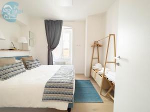 Postel nebo postele na pokoji v ubytování Corridoni 2E Tirabora Short Rent