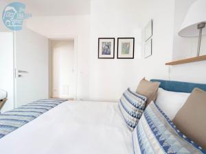 Postel nebo postele na pokoji v ubytování Corridoni 2E Tirabora Short Rent
