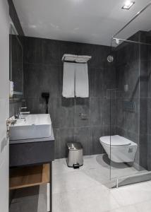 a bathroom with a sink and a toilet and a shower at Hotel Bavaro in Sunny Beach