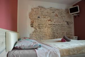 Postel nebo postele na pokoji v ubytování Casa Piccola