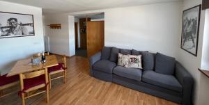 a living room with a couch and a table at B&B CHALET NICOLUSSI in Trento