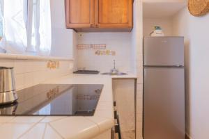 Kuchyň nebo kuchyňský kout v ubytování La Corte - HelloElba