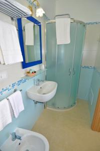 a bathroom with a sink and a shower at B&B Lu Cantoru in Marina di Pescoluse