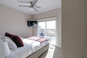 a bedroom with a bed with a ceiling fan at Toroweap-4bed,3bath,hot tub,deck in Hildale