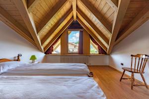 A bed or beds in a room at Agritur Cristina