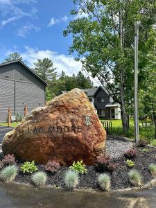 a large rock with the words lake moore written on it at Condos Kamik Tremblant in Mont-Tremblant