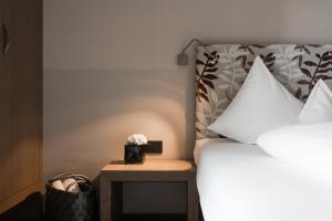 Posteľ alebo postele v izbe v ubytovaní Boutiquehotel Minigolf