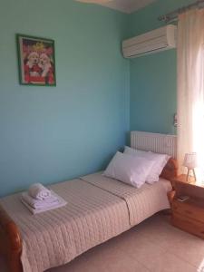 Кровать или кровати в номере SIMOS' sea view house