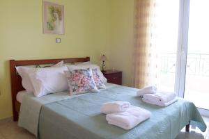 Кровать или кровати в номере SIMOS' sea view house