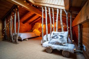 a room with a swing in a cabin at Savoya Lodges in Châtel