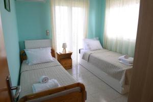 Кровать или кровати в номере SIMOS' sea view house