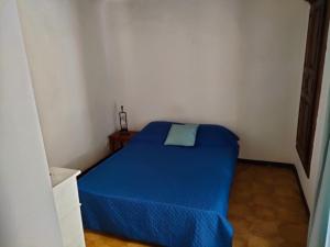 מיטה או מיטות בחדר ב-OLMETA DI TUDA - T3