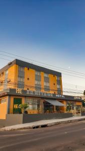 a building on the side of a street at Hotel Ermitage in Santana do Livramento