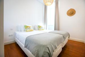 Postel nebo postele na pokoji v ubytování Faro Away From Home Apartment + 16 fotografií