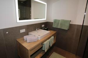 a bathroom with a sink and a mirror at Apart Christoph in Oetz +7 photos