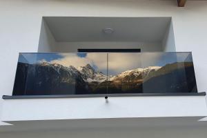 a window with a picture of a mountain at Apart Christoph in Oetz