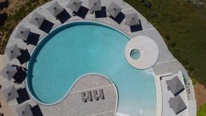 an overhead view of a swimming pool at Kavos Hotel & Suites in Stavros